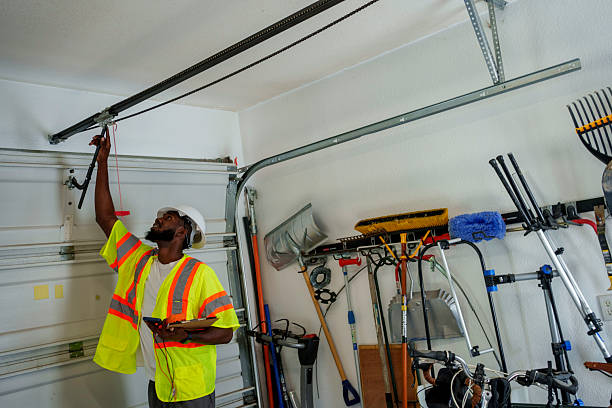 Professional Garage Door Installation technician working in East Rochester, NY